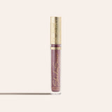 ShadowSense Eyeshadow NZL in a tall clear tube with purple glittery formula and an ornate gold cap