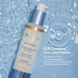 SeneGence GLP Complex serum bottle with pump on a blue water background